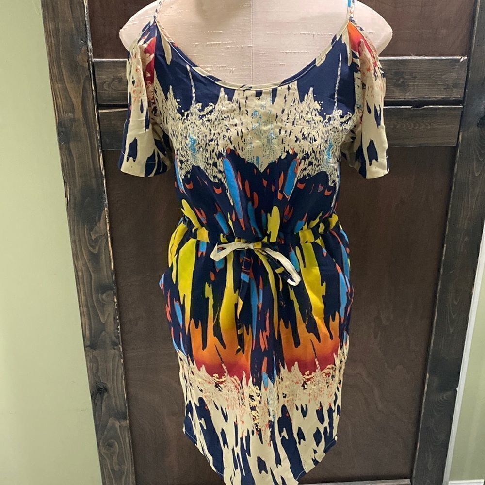 Off the shoulder Retro Dress with tie waist, pockets, & back cut out accent.